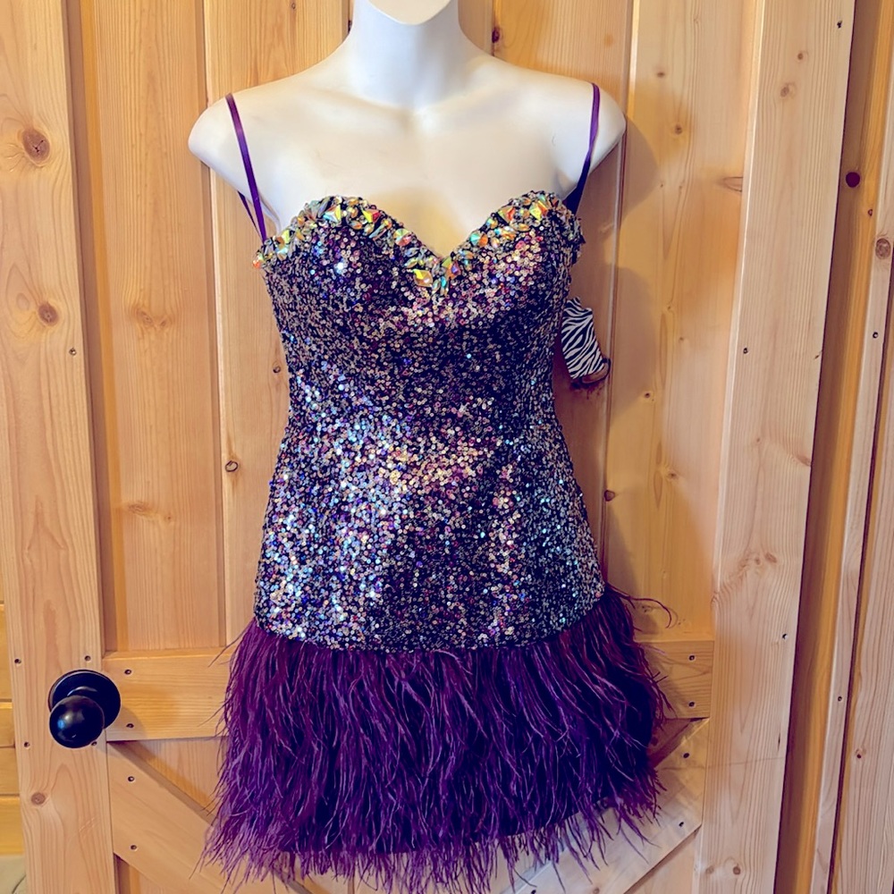 Perfect Mardi’s Gras dress !! It is new with tags and sparkles beautifully!!